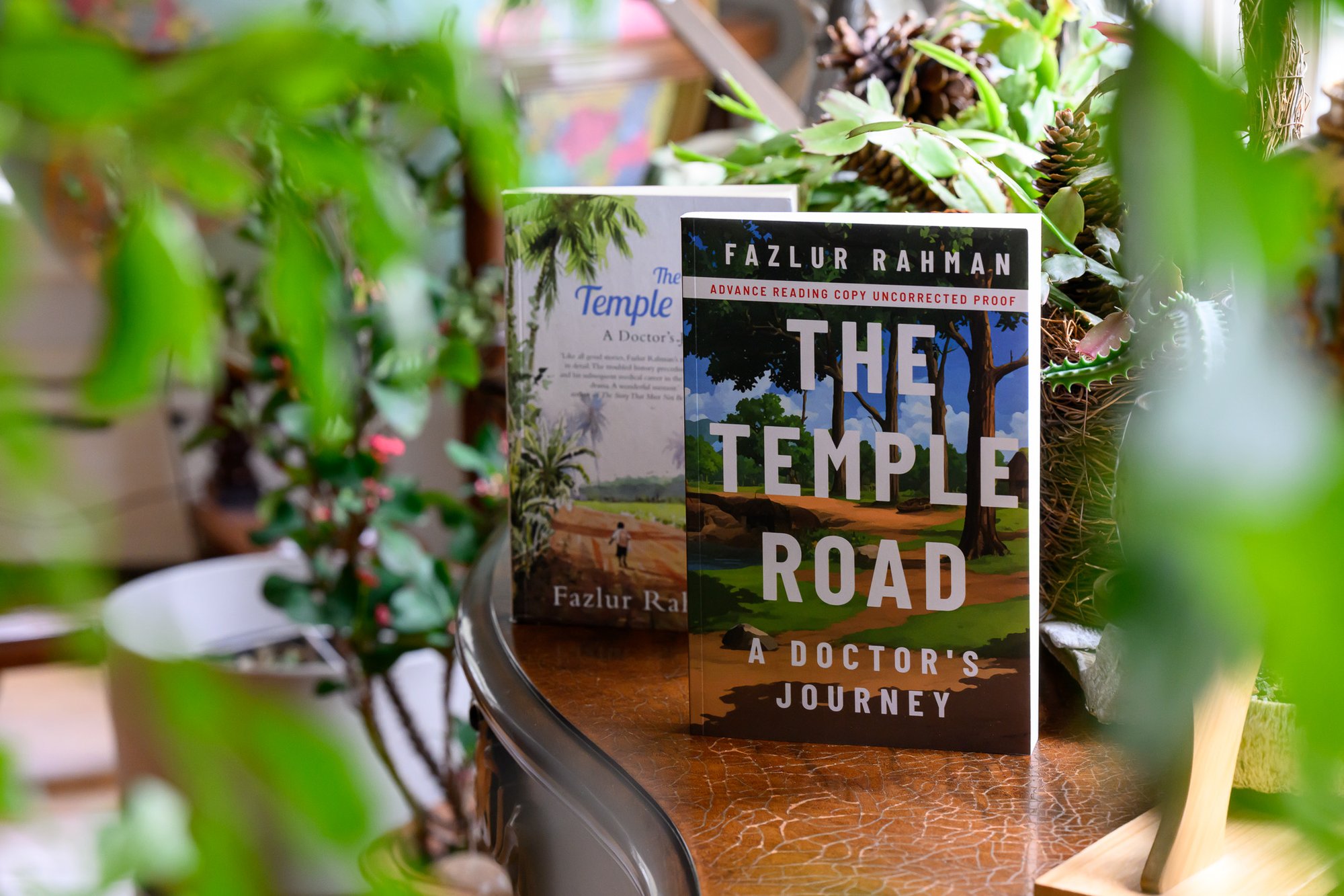 The American galley and Indian edition of THE TEMPLE ROAD by Dr. Fazlur Rahman set back among plants and greenery. ©Sean Sime